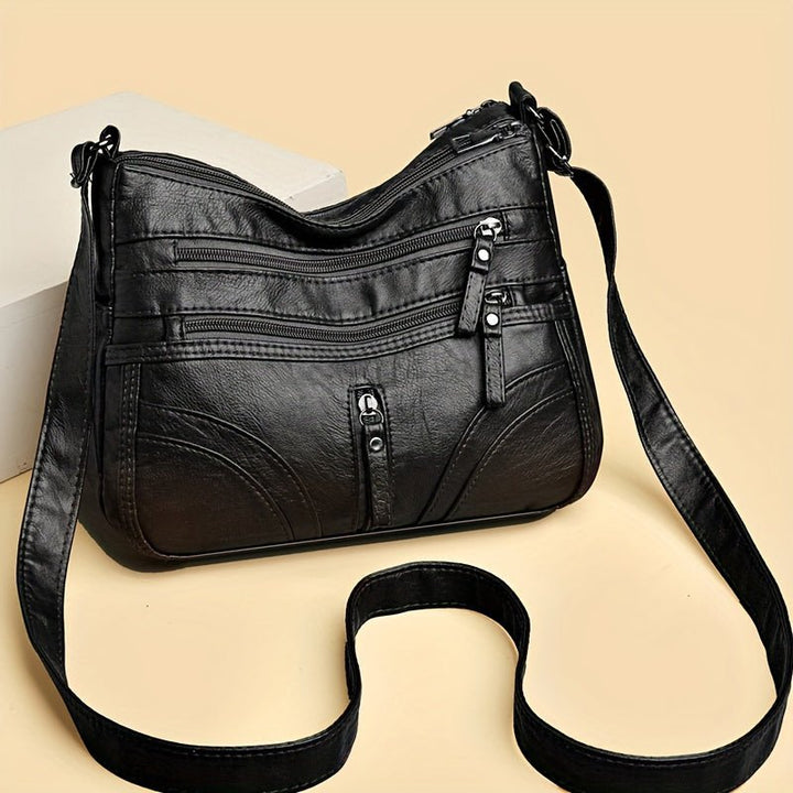 Esme - Crossbody-taske med flere rum